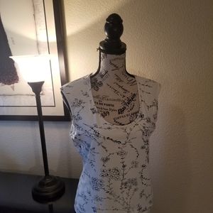 Cream sleeveless top with sparkles and black patte